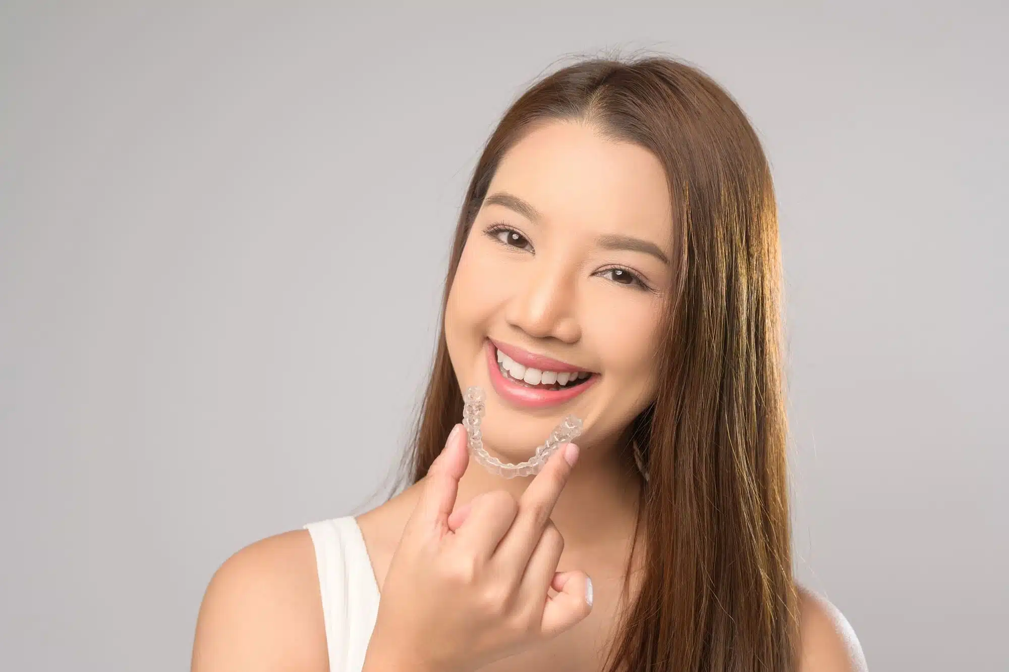 Chestnut Hill patient smiling with Invisalign clear aligners at Farrow Orthodontics